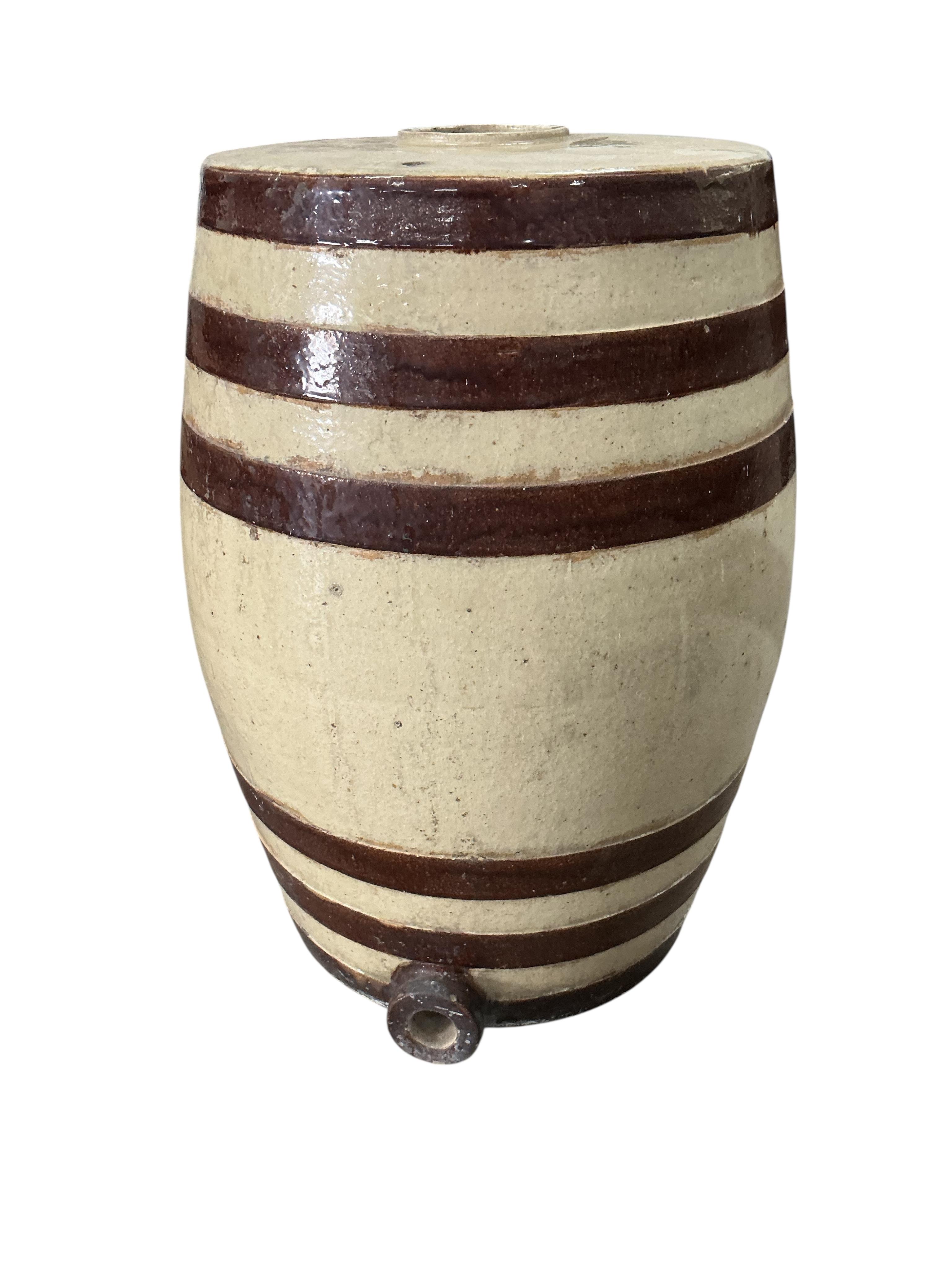 Two Victorian Doulton and Watts salt-glazed stoneware barrels, larger diameter 46cm, height 68cm, Provenance: The late Kenneth Turner (1936-2025), celebrity florist, designer and perfume retailer, he received the Royal W